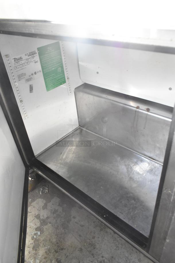 True TUC-60 stainless steel undercounter cooler interior, commercial casters, 115V, 1 phase, model label visible.