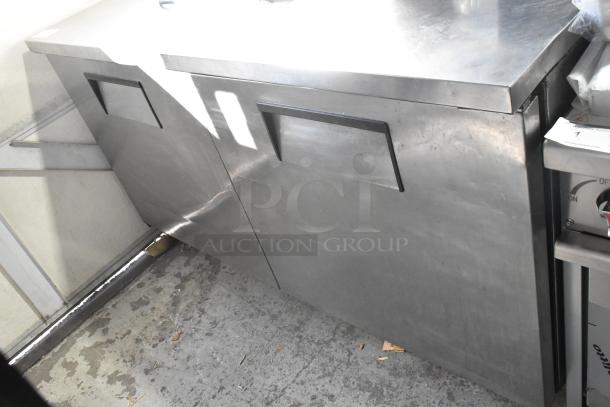 True TUC-60 stainless steel 2-door undercounter cooler on commercial casters. 115 volts, 1 phase. Good condition.