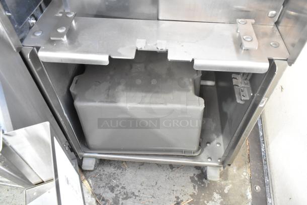 Stainless steel JBT 2 GEN MFJ floor-style citrus juicer on casters, 120V, 1-phase. Features commercial design and durable construction.