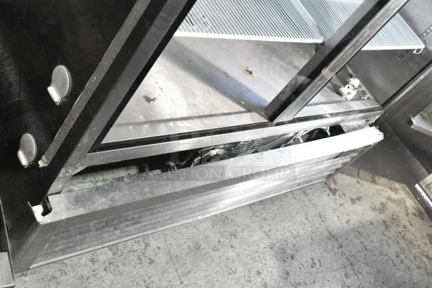 2021 Padela PDB-2F-HC stainless steel 2-door reach-in freezer, missing doors, poly-coated racks, 115V, 1 phase.