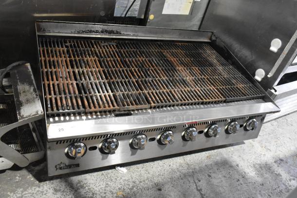 Star Ultra Max stainless steel gas-powered charbroiler grill, commercial countertop model, with multiple control knobs and worn grates.