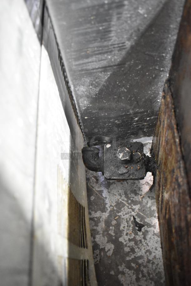 Star Ultra Max stainless steel commercial gas-powered charbroiler grill, showing corner detail with some wear.