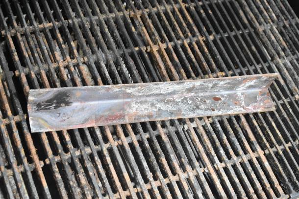 Star Ultra Max Stainless Steel Gas Charbroiler Grill, used condition, showing grill surface with rust and wear marks.