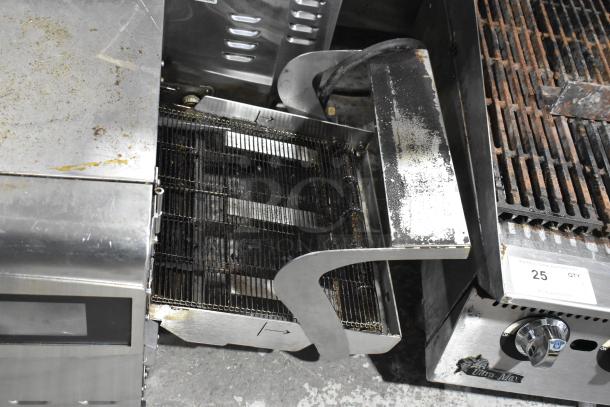 Ovention stainless steel electric conveyor pizza oven, used, 208/240V, 3 phase. Visible wear and stains on the surface.