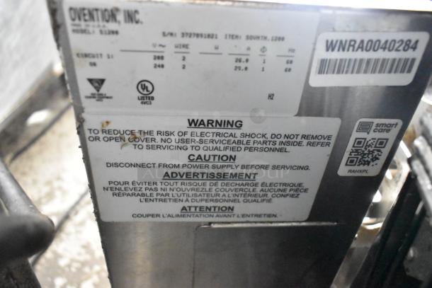 Ovention stainless steel commercial countertop conveyor pizza oven label, showing voltage, model, and safety warnings.