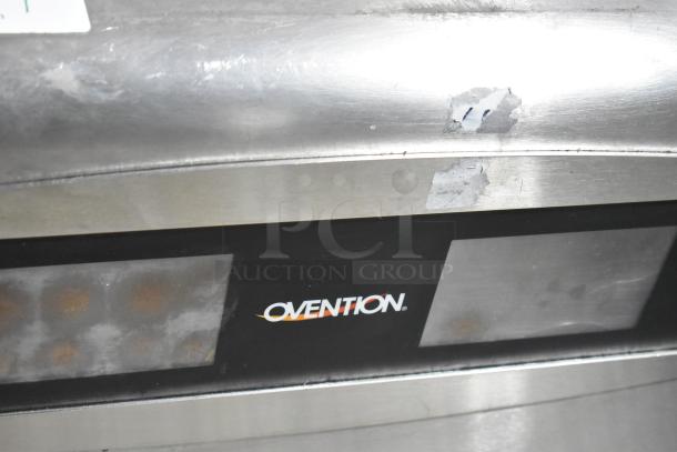 Ovention stainless steel electric conveyor pizza oven, 208/240V, 3 phase. Features visible logo, some surface wear.