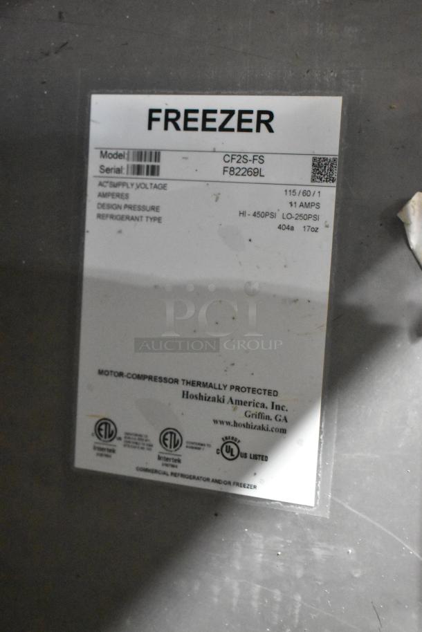 2017 Hoshizaki CF2S-FS stainless steel 2-door freezer on casters, 115V, model label with specifications shown.