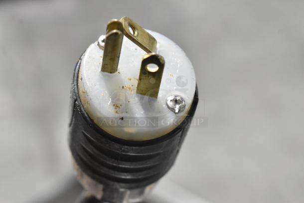 Close-up of a plug for the 2018 Pitco Frialator PCC28 stainless steel commercial fry warmer, showing metal prongs and screws.