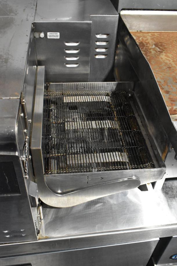 Ovention S1200 stainless steel commercial conveyor pizza oven. Electric, 208/240V, 3-phase. Minor wear, clean with visible grates.