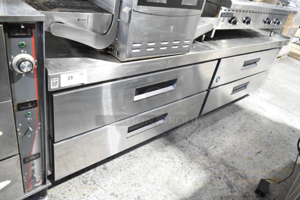 Hoshizaki stainless steel 4-drawer chef base on commercial casters, 115 volts, 1 phase, excellent condition, visible item tag.