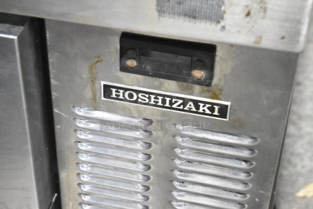 Hoshizaki stainless steel 4-drawer chef base with commercial casters, 115 volts, 1 phase, showing the Hoshizaki logo.