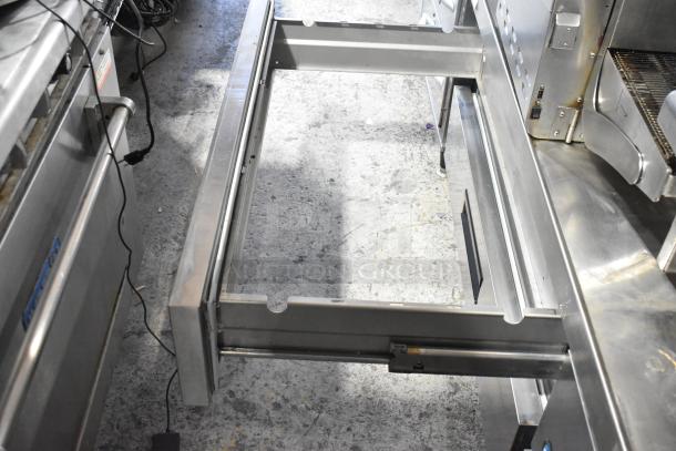 Hoshizaki stainless steel commercial chef base with 4 drawers on casters, 115 volts, 1 phase, shown in used condition.