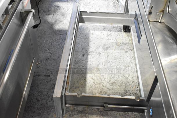 Hoshizaki stainless steel 4-drawer chef base on commercial casters, 115V, 1 phase, visible wear. Ideal for commercial kitchens.