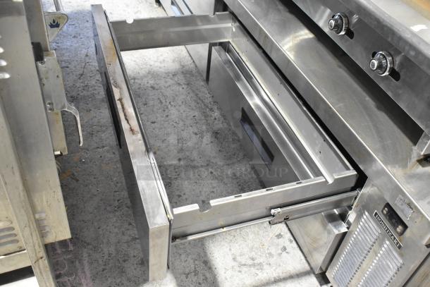 Hoshizaki stainless steel commercial chef base with 4 drawers on casters, showing an open drawer and brand label. 115 Volts, 1 Phase.