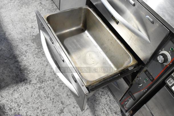 APW Wyott HDDi-3-120-4L-S stainless steel 3-drawer warming drawer, 120 volts, used condition, commercial appliance.