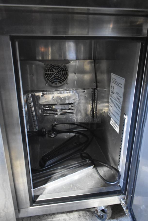 Turbo Air JBT-48-N stainless steel refrigerated buffet table interior, showing a cooling fan and electrical components. 115 Volts, 1 phase.