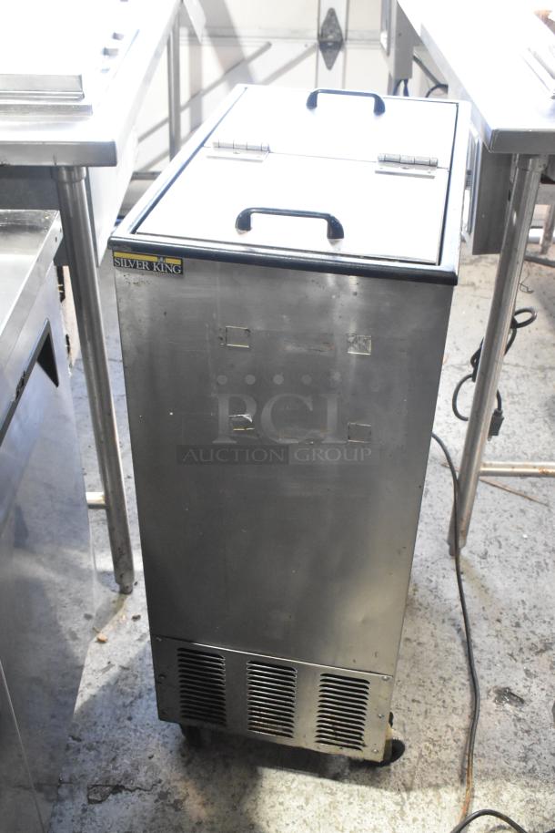 Silver King stainless steel commercial chest cooler on casters, 115 volts, 1 phase. Slight wear visible, brand label intact.