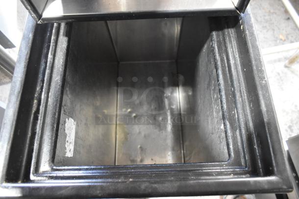 Silver King stainless steel commercial chest cooler with casters, 115 volts, 1 phase, interior view showing wear.