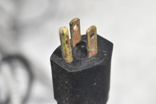 Power plug of APW Wyott Stainless Steel Commercial 2 Well Steam Table, 115 Volts, 1 Phase, showing slight wear.