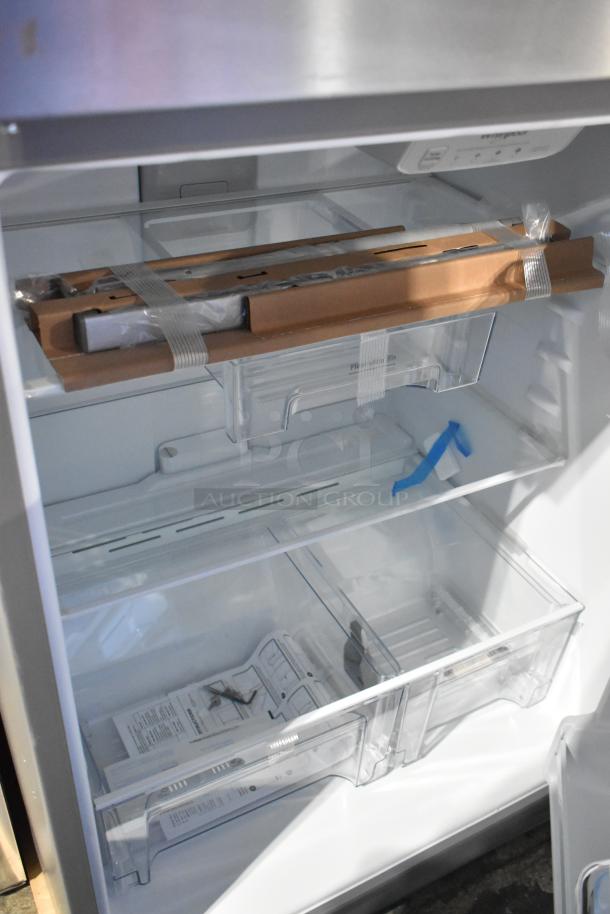 Stainless steel Whirlpool 21MSTFATR6 cooler-freezer, brand new with minor dents. Features clear drawers and interior packaging. 115V, 1 phase.