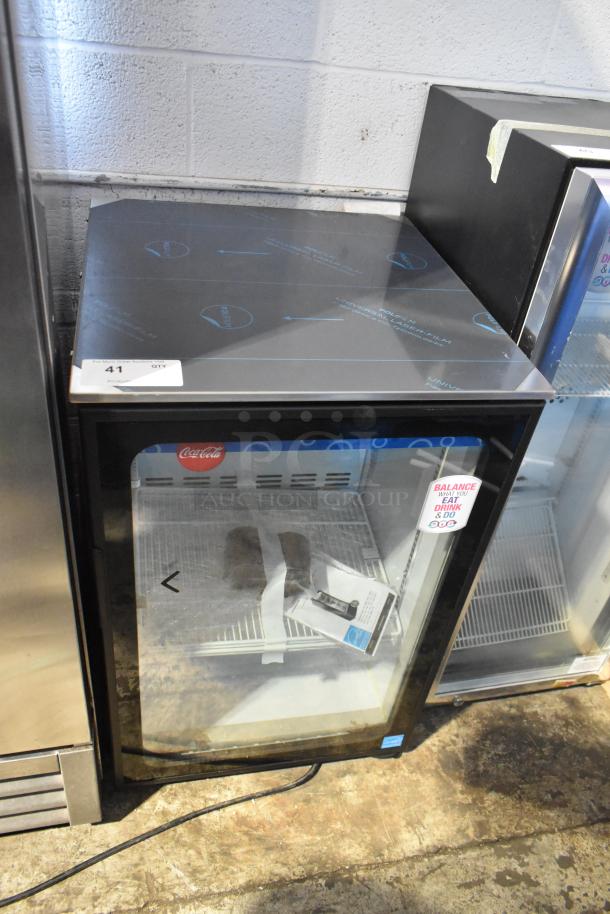 Imbera EVC04 metal mini cooler merchandiser, 115 volts, 1 phase. Features glass door and interior shelving.