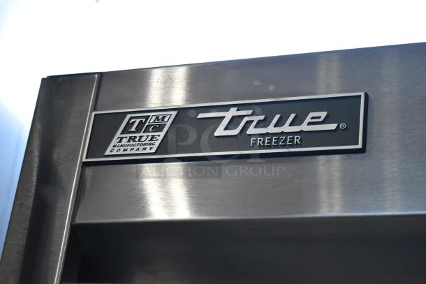 2017 True T-19F stainless steel commercial freezer, single door, with poly-coated racks. True logo visible, 115 volts, 1 phase.