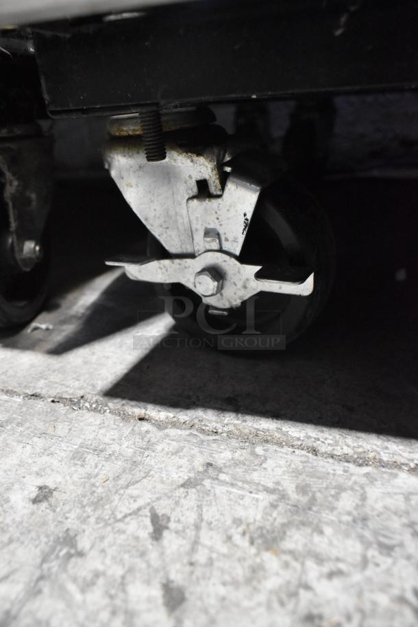 2016 True T-35 cooler caster. Sturdy commercial caster on concrete floor, part of the 2-door reach-in model.