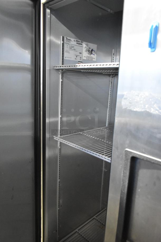 2016 True T-35 stainless steel cooler, 2-door, poly-coated racks, commercial casters, 115V, 1 phase. Interior view.