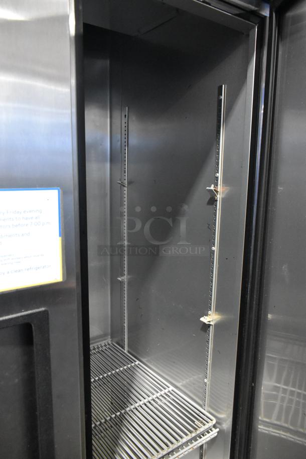 2016 True T-35 stainless steel commercial 2-door reach-in cooler with poly-coated racks, on commercial casters.