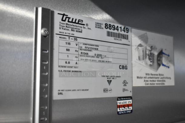 2016 True T-35 stainless steel commercial 2-door reach-in cooler label, 115V, 1 phase, model details visible.