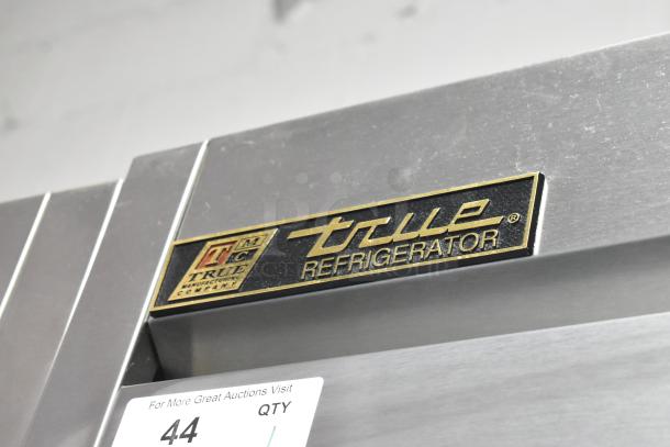 True T-35 stainless steel commercial 2-door cooler, features poly-coated racks, commercial casters, 115V, 1 phase.