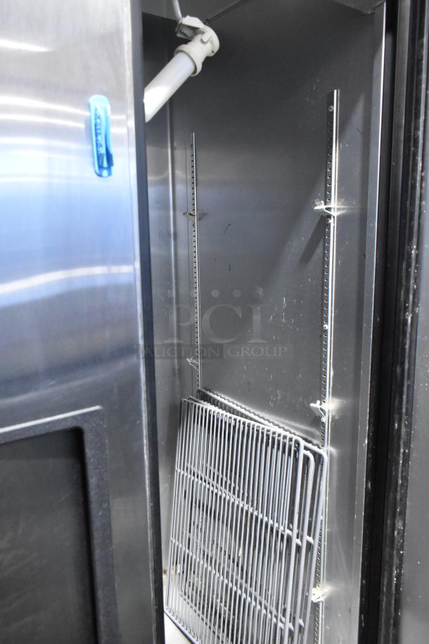 True T-35 stainless steel commercial cooler, two-door design with poly coated racks and commercial casters. 115V, 1 phase.