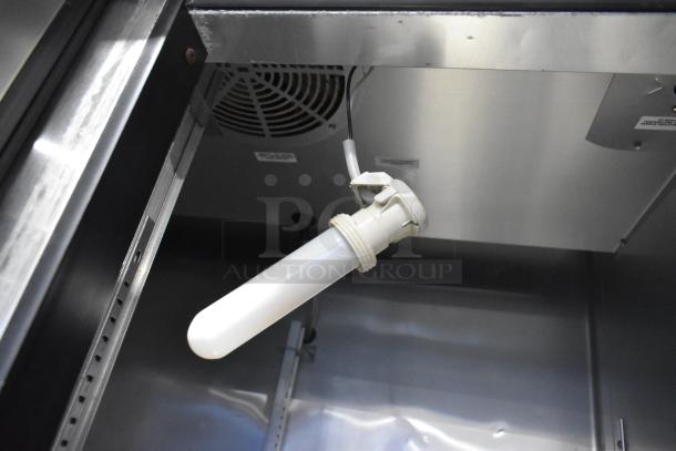 True T-35 stainless steel cooler interior, showing fan and light fixture. Model details on interior panel. 115V, 1 Phase.