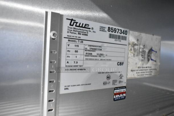 True T-35 stainless steel commercial cooler label. Model details, voltage 115V, phase 1, refrigerant R134A, NSF certified.