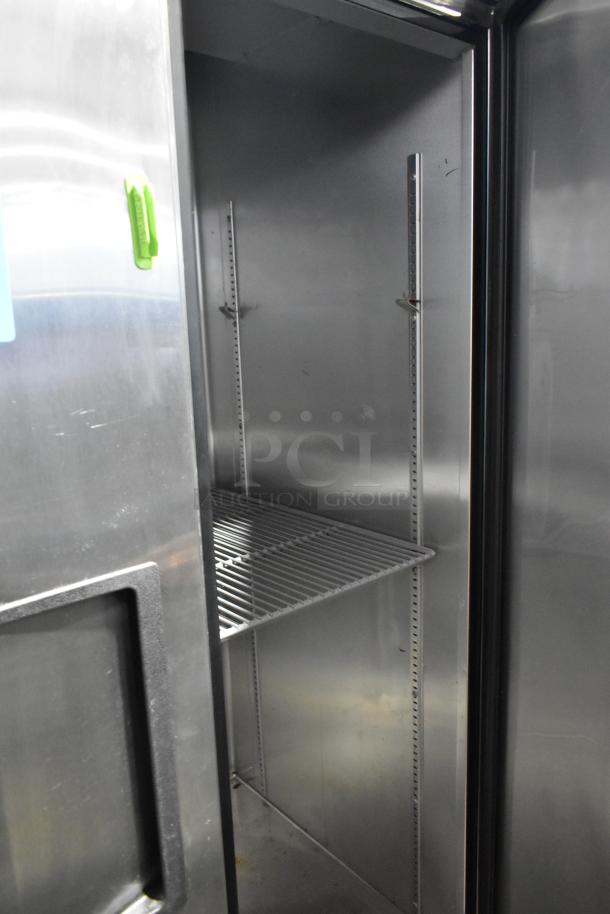 True T-35 stainless steel commercial cooler, 2 doors, poly-coated racks, on casters. 115 volts, 1 phase, clean condition.