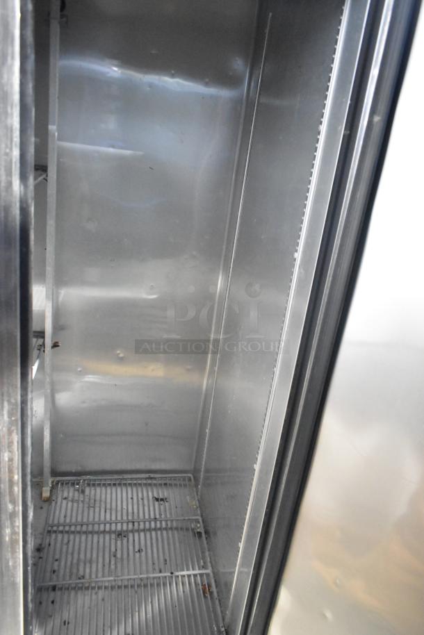 2017 True T-35 stainless steel commercial cooler interior with poly coated racks, 2 doors, 115 volts, 1 phase.