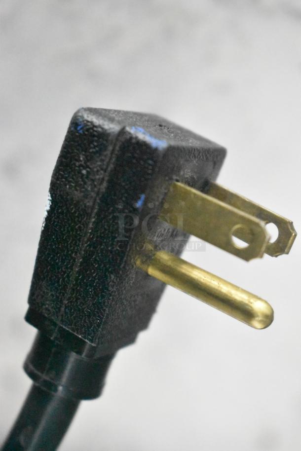 Close-up of the electrical plug for a 2017 True T-35 stainless steel commercial cooler, 115 volts, 1 phase.