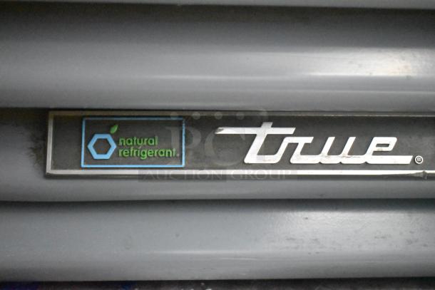 True GDM-12-HC cooler, natural refrigerant label, metal frame, poly coated racks, 115V, 1 phase, single door.