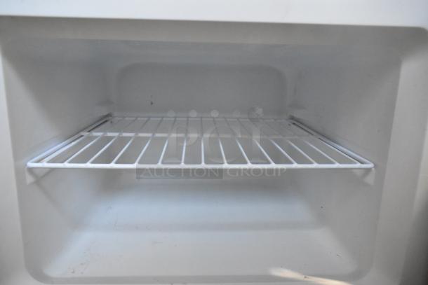 2021 Thomson TFR725-C stainless steel reach-in cooler, unused interior. Includes internal shelf. Model TFR725-C, 115V, 1 Phase.