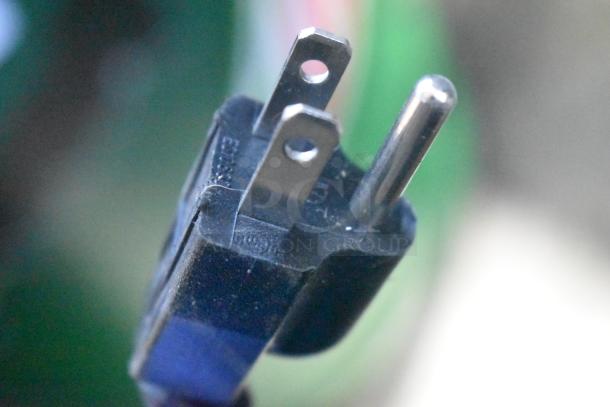 Close-up of a three-prong power plug, associated with a 2021 Thomson TFR725-C Reach In Cooler with Freezer, 115V, 1 Phase.