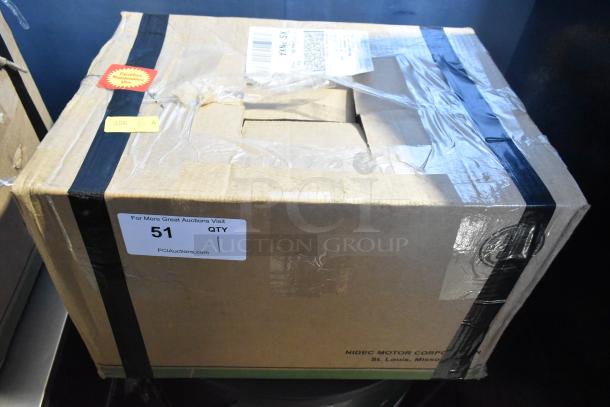 Sealed box containing Nema HD98 Motor, 230/460V, 3 Phase. Box shows shipping labels and auction stickers.