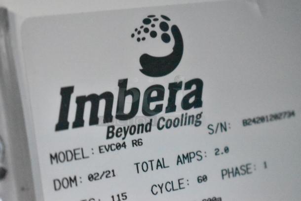 Imbera EVC04 metal commercial mini cooler label, showing model, amps, voltage, and DOM: 02/21.