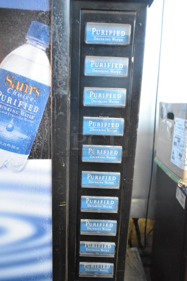 Royal Vendors RCVDE7 commercial vending machine, metal, 115 volts, for bottled drinks, cash acceptor included.