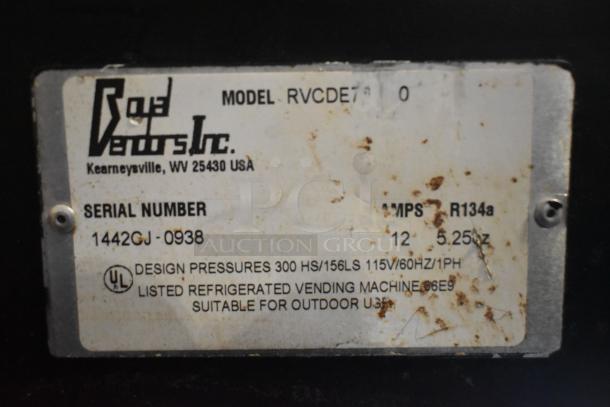 Royal Vendors RCVDE7 vending machine label showing model, serial number 1442GJ-0938, 115V, 1 phase, outdoor use suitability.