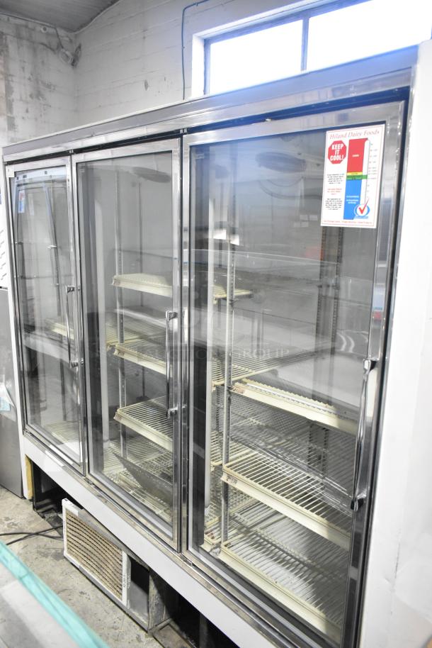 Zero Zone TA30AWCF 3 Door Metal Reach-In Cooler with poly-coated racks, 115V, 1 Phase, commercial use, excellent condition.