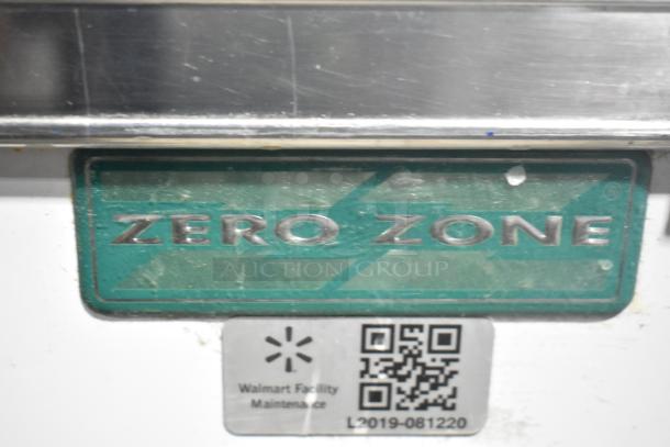 Zero Zone TA30AWCF metal 3-door cooler with poly-coated racks, model tag and maintenance label visible.