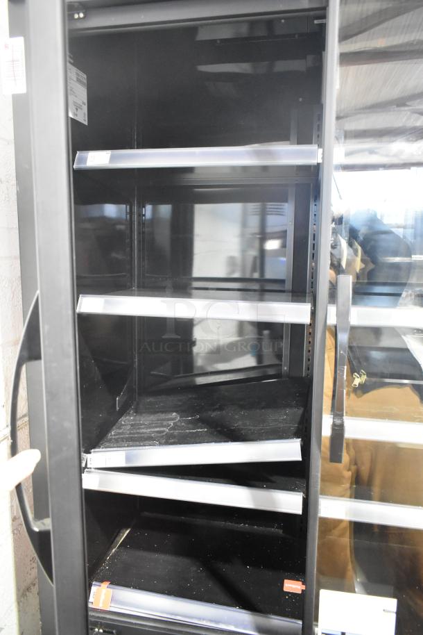 2021 True TVM-48SL-HC 2 Door Reach-In Cooler, metal shelves, 115V, 1 phase, commercial condition, interior view.