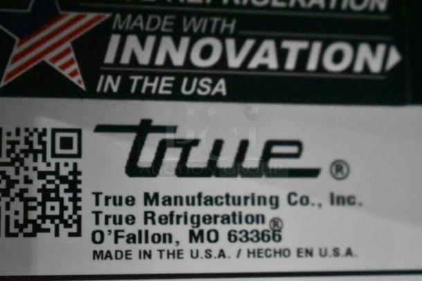2021 True TVM-48SL-HC cooler tag showing "Made in the USA" by True Manufacturing, O'Fallon, MO, with QR code.