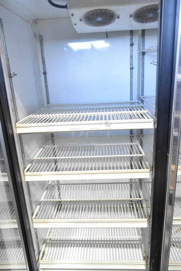 Zero Zone 0101-O-R-NT-CF-L-NL-U-C commercial two-door reach-in cooler with poly-coated racks, 115V, 1 phase.