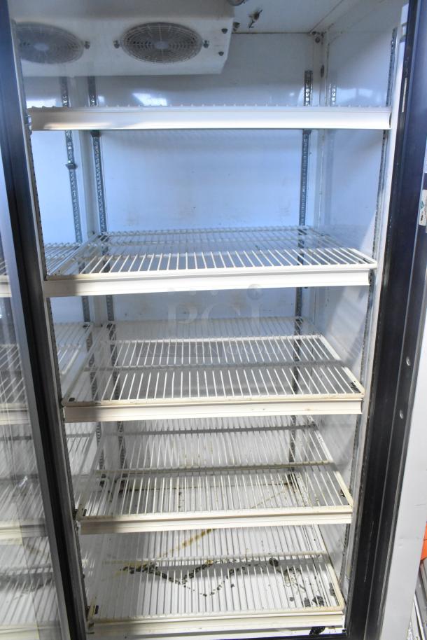 Zero Zone 2 door reach-in cooler with poly coated racks, model 0101-O-R-NT-CF-L-NL-U-C, 115V, 1 phase.